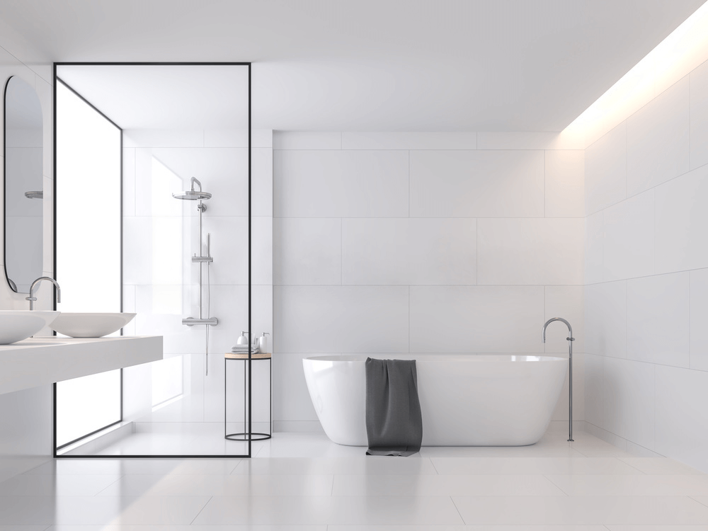White shower room with glass doors and tub
