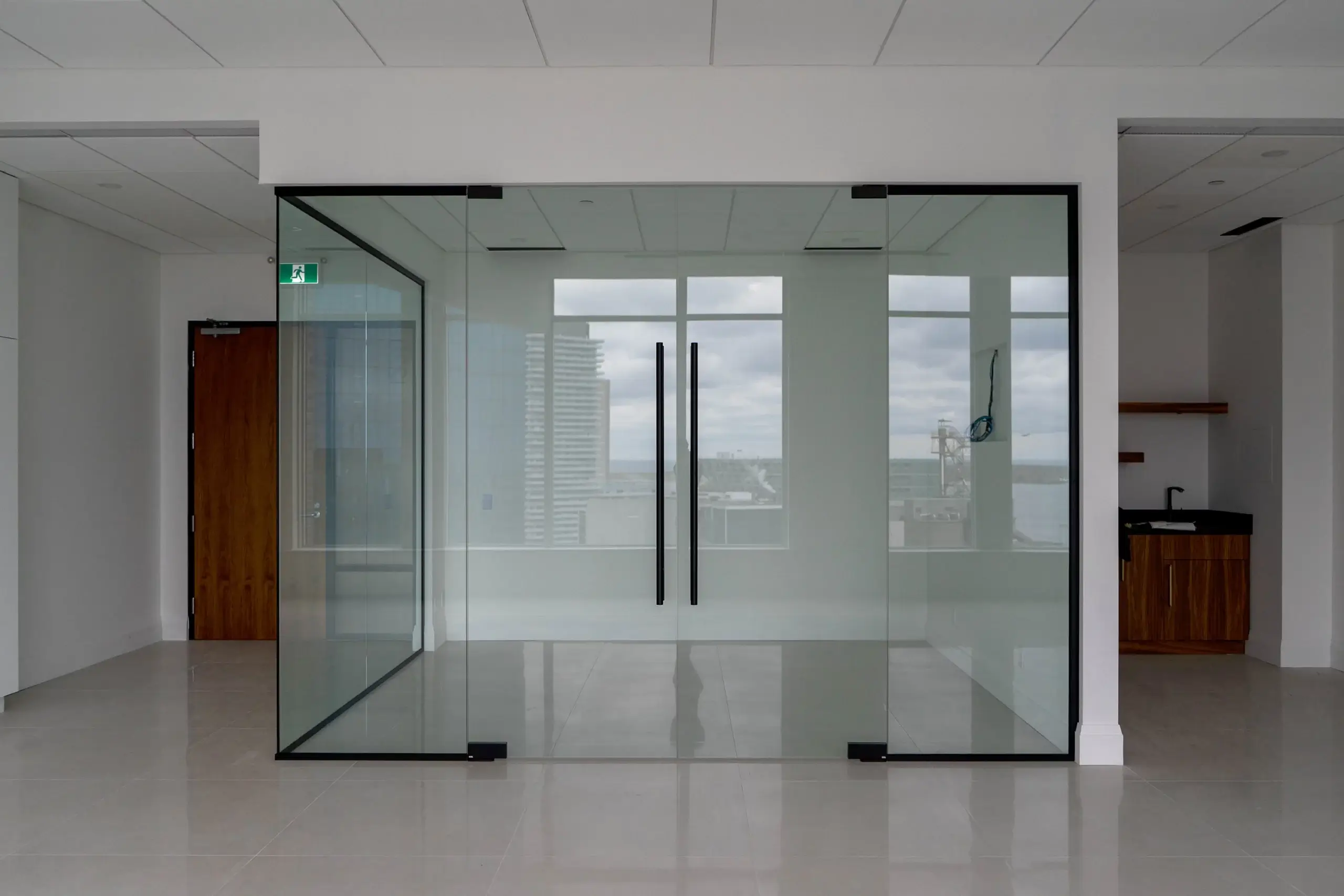 Glass office partition with two closed glass doors. Patch system - side glass office partitions. Front View